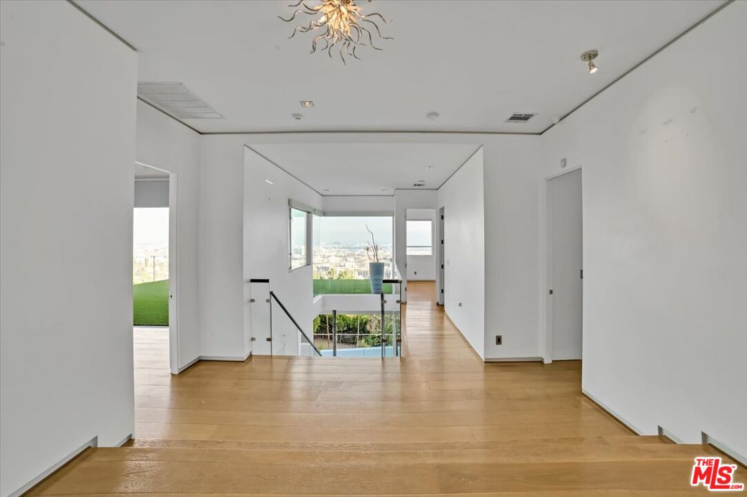 7044 Los Tilos Road Los Angeles, CA 90068 - Photo 4 of 58 a view of an entryway with wooden floor
