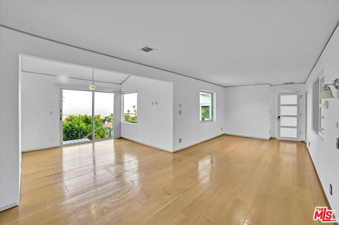 7044 Los Tilos Road Los Angeles, CA 90068 - Photo 41 of 58 an empty room with windows and entrance