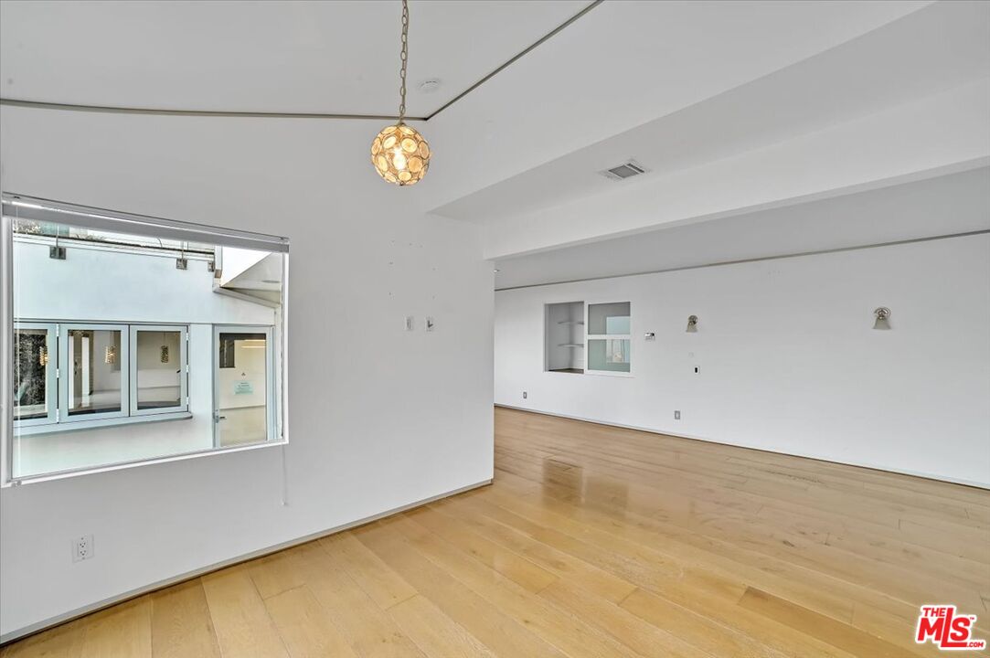 7044 Los Tilos Road Los Angeles, CA 90068 - Photo 42 of 58 a view of an empty room with a window