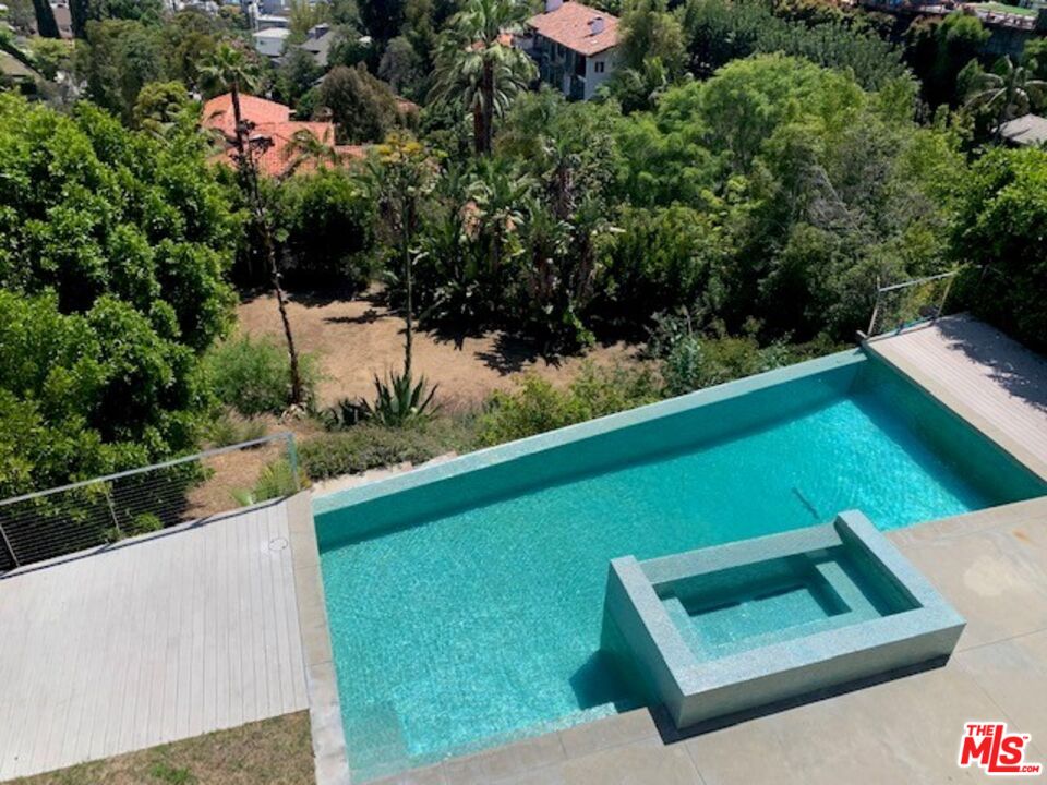 7044 Los Tilos Road Los Angeles, CA 90068 - Photo 49 of 58 a view of a two chairs and table in a yard