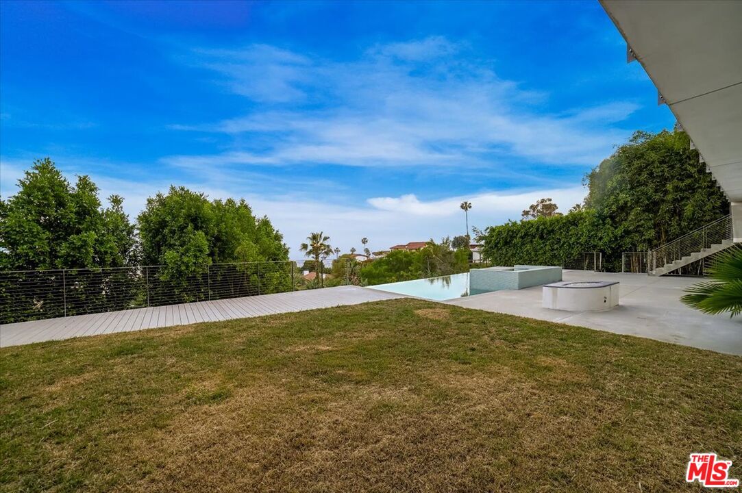 7044 Los Tilos Road Los Angeles, CA 90068 - Photo 51 of 58 a view of a swimming pool with an ocean view