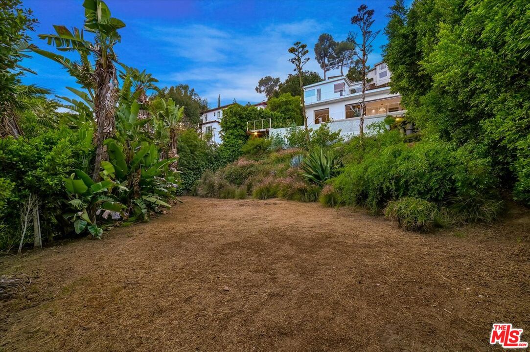 7044 Los Tilos Road Los Angeles, CA 90068 - Photo 52 of 58 a view of a house with a yard