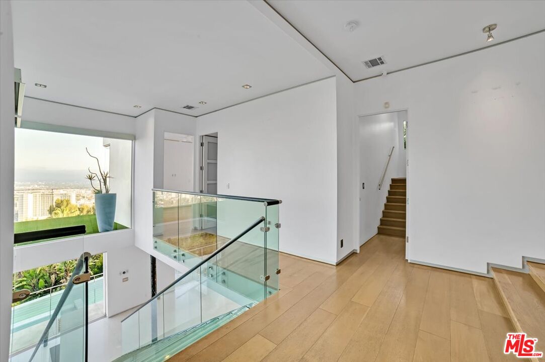 7044 Los Tilos Road Los Angeles, CA 90068 - Photo 6 of 58 a view of an entryway with wooden floor