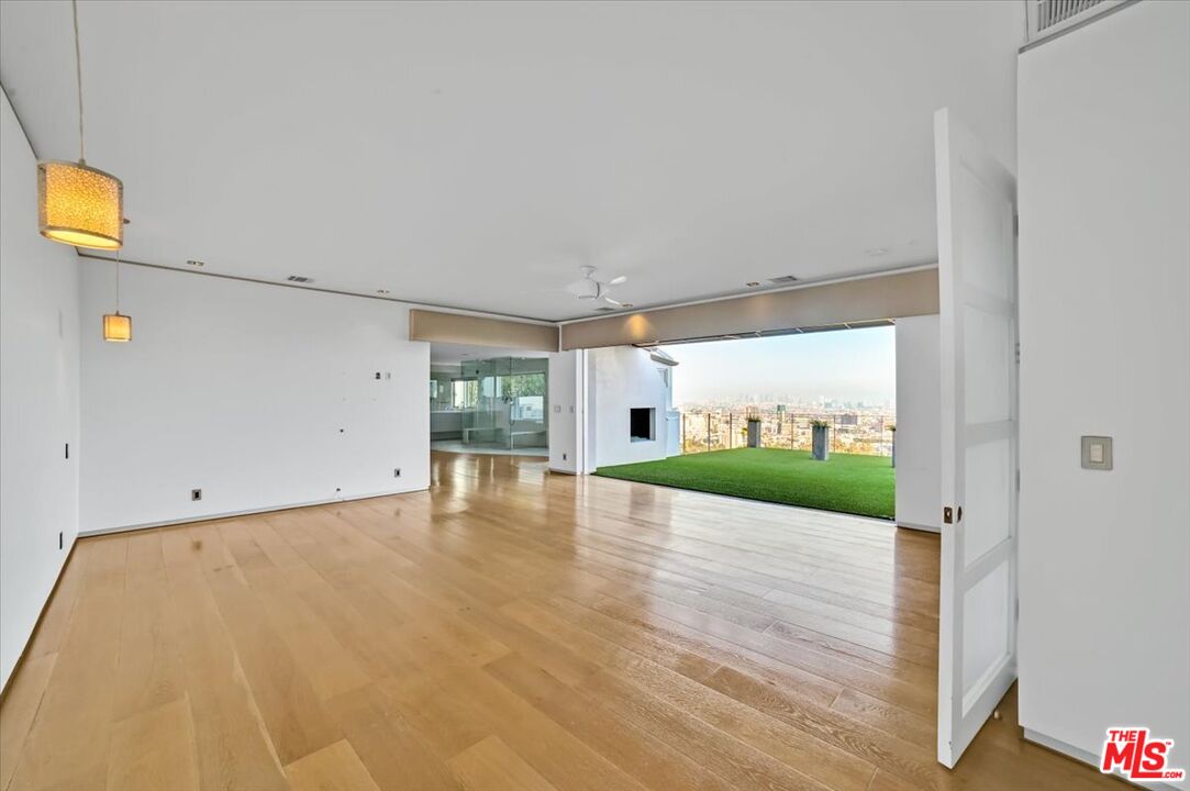 7044 Los Tilos Road Los Angeles, CA 90068 - Photo 7 of 58 a view of a room with wooden floor and window