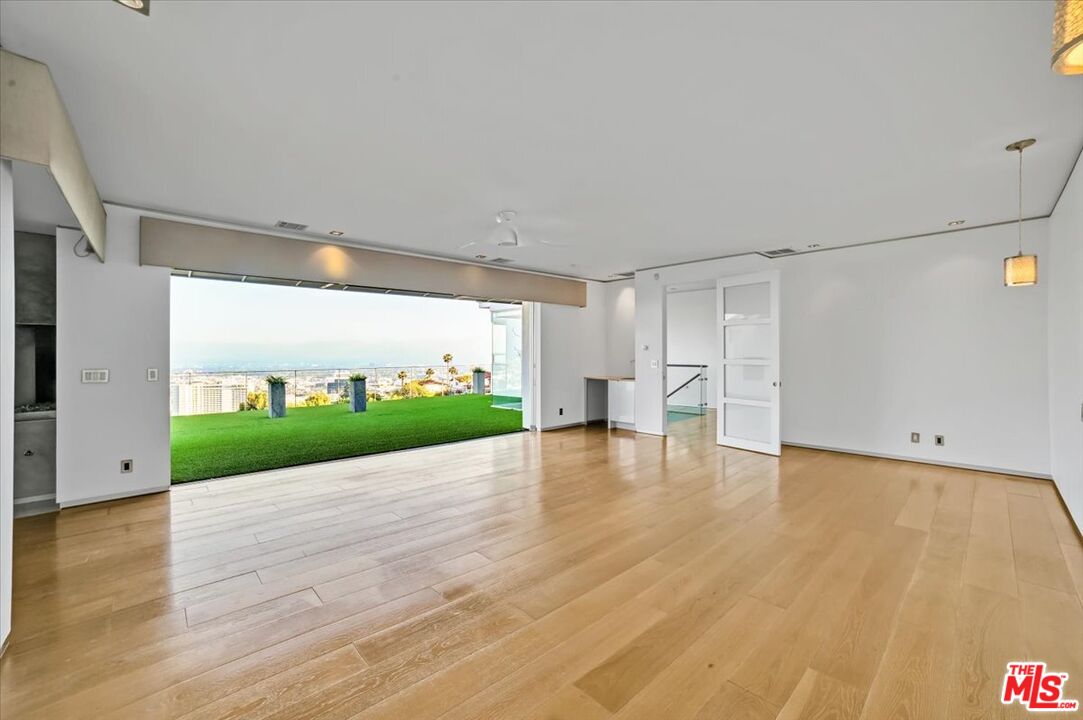 7044 Los Tilos Road Los Angeles, CA 90068 - Photo 8 of 58 a view of an empty room with a kitchen