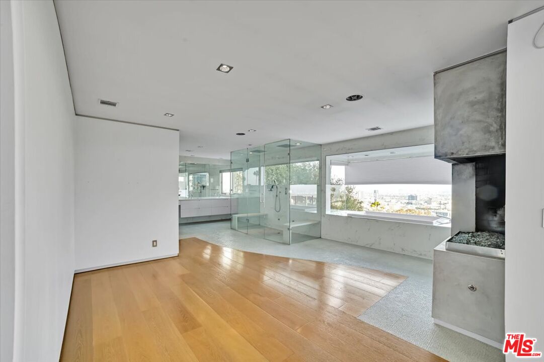 7044 Los Tilos Road Los Angeles, CA 90068 - Photo 9 of 58 a view of a kitchen with a sink and dishwasher wooden floor