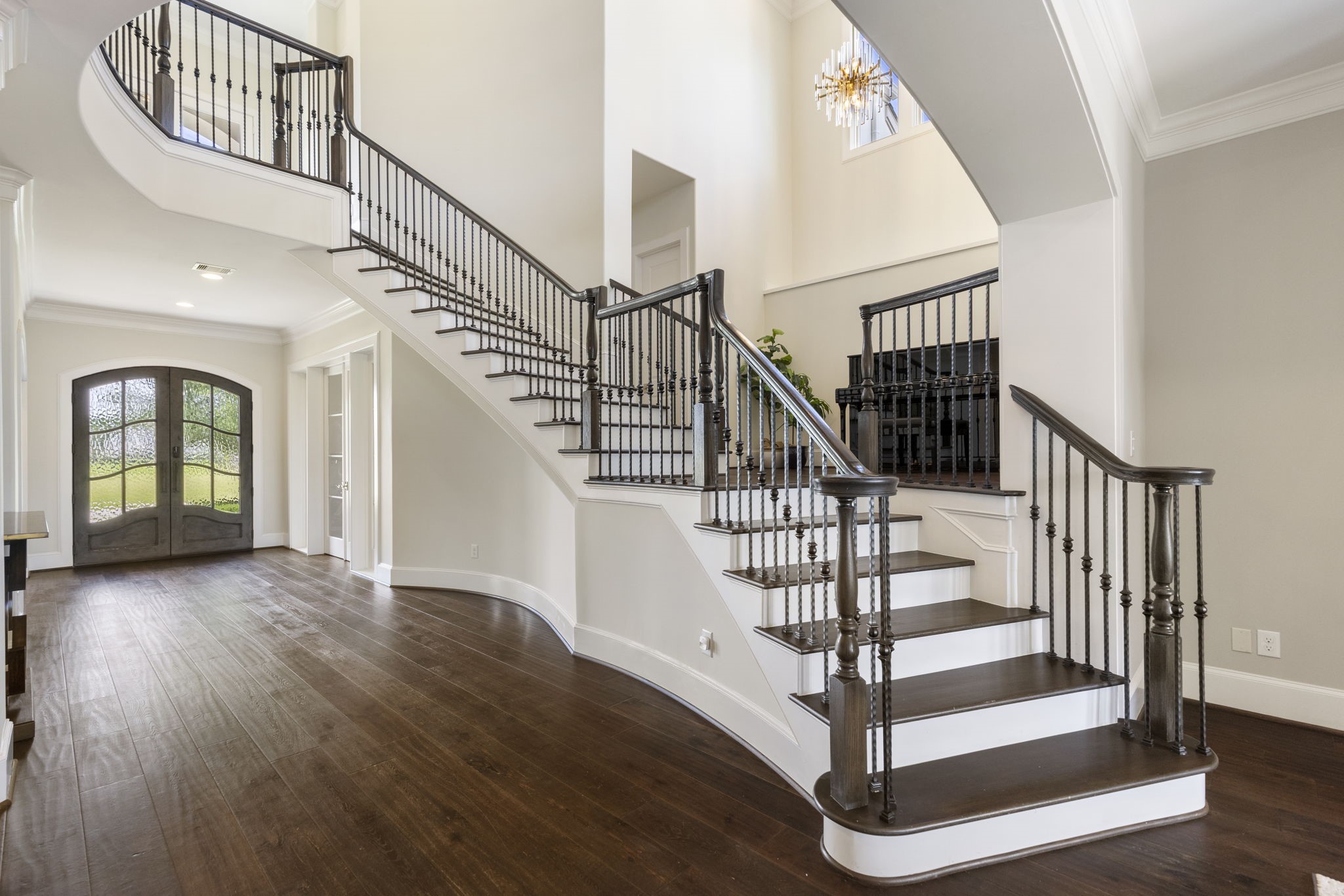 6806 West Warwick Lake Lane Spring, TX 77389 - Photo 28 of 50 a view of entryway with wooden floor and stairs