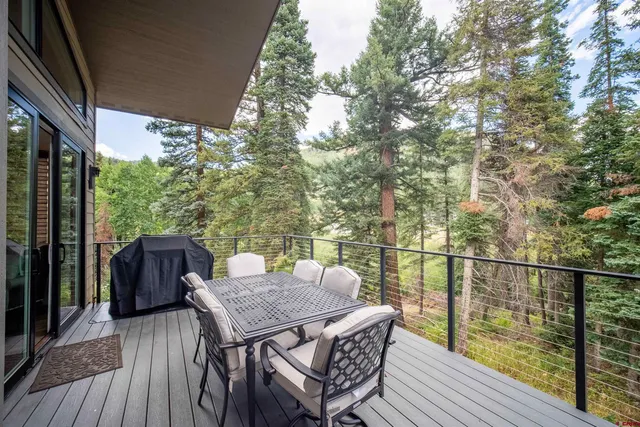 a view of a balcony with furniture