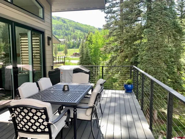 a balcony view with a seating space