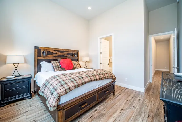 a bedroom with a bed and a dresser