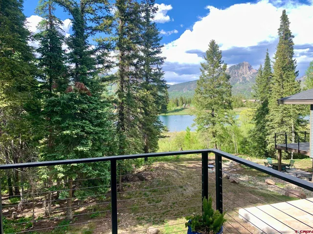 a view of a balcony with a tree