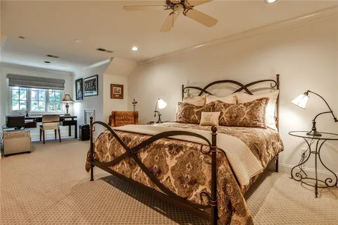 a bedroom with bed and a couch