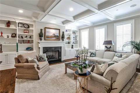a living room with furniture fireplace and flat screen tv