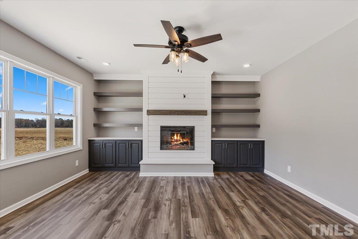 9793 Chapman Road Bailey, NC 27807 - Photo 3 of 31 a view of a livingroom with a fireplace and window