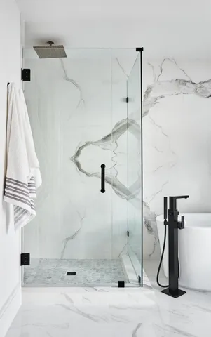 a bedroom with a bed and a potted plant