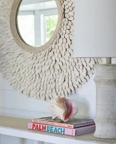 a bathroom with a bathtub and mirror