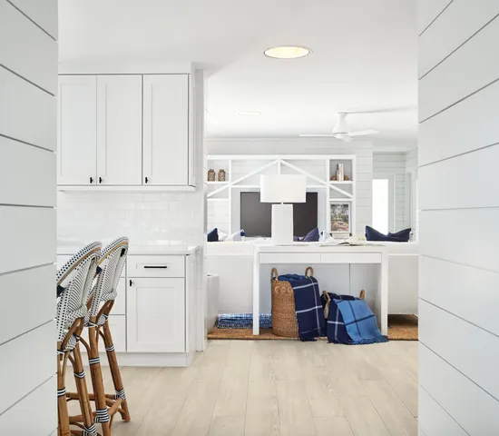 a view of a kitchen with furniture and windows
