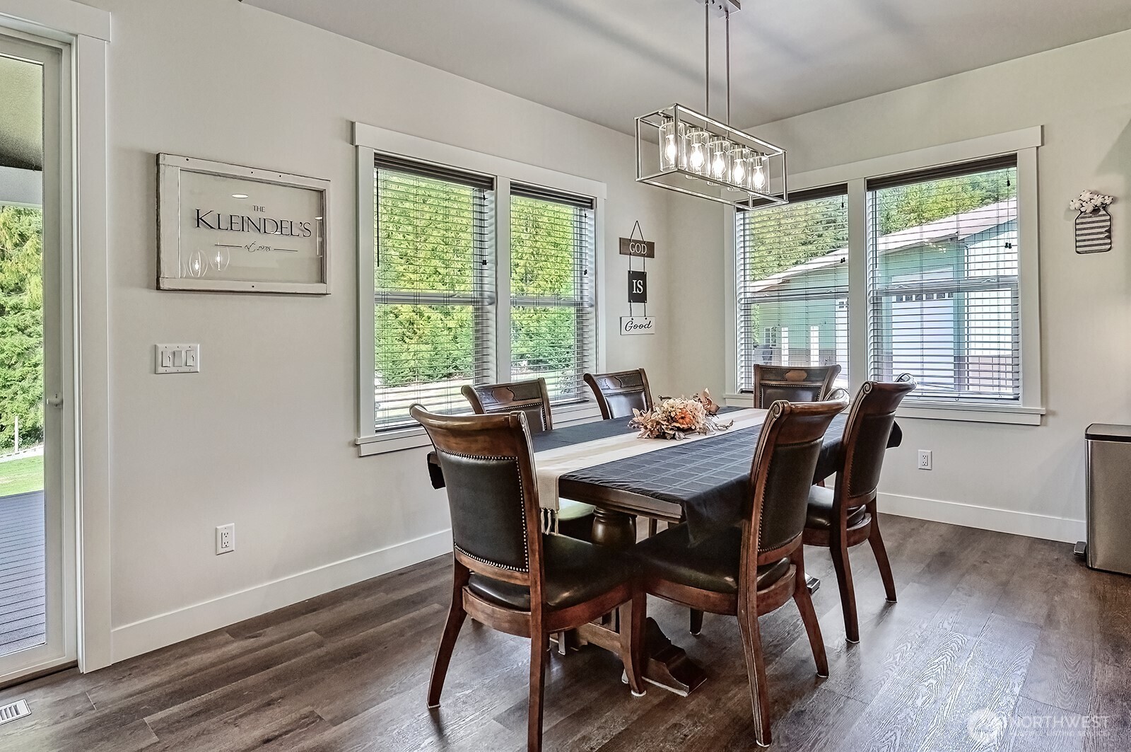 19443 Oakleaf Lane Sedro-Woolley, WA 98284 - Photo 11 of 40 a view of a dining room with furniture window and wooden floor
