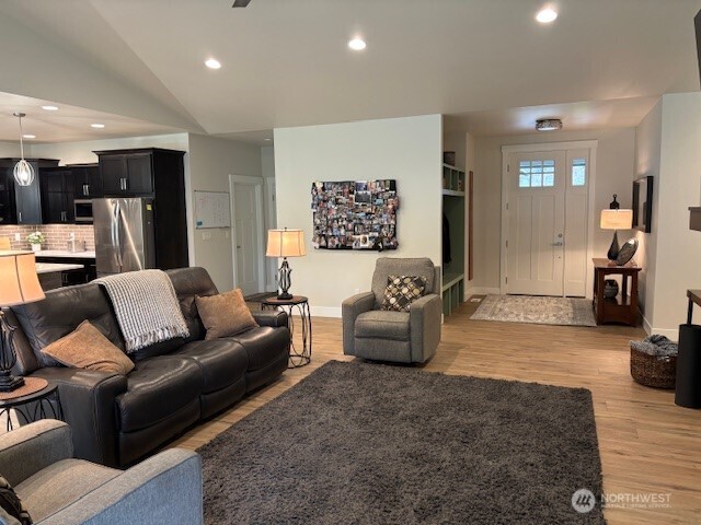 19443 Oakleaf Lane Sedro-Woolley, WA 98284 - Photo 12 of 39 a living room with furniture and a flat screen tv