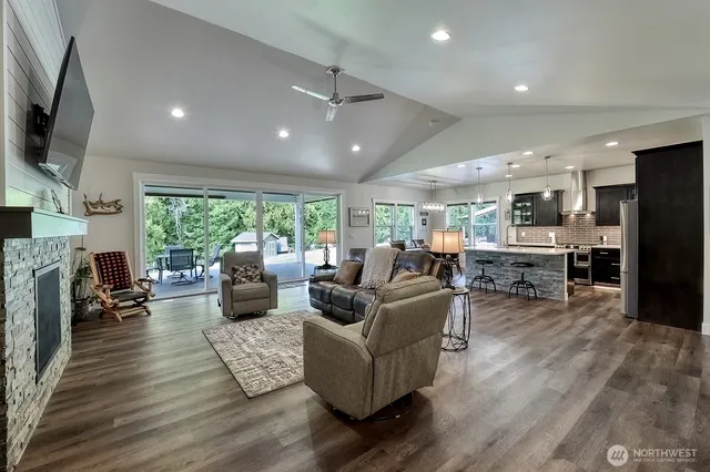 a living room with fireplace furniture and a flat screen tv