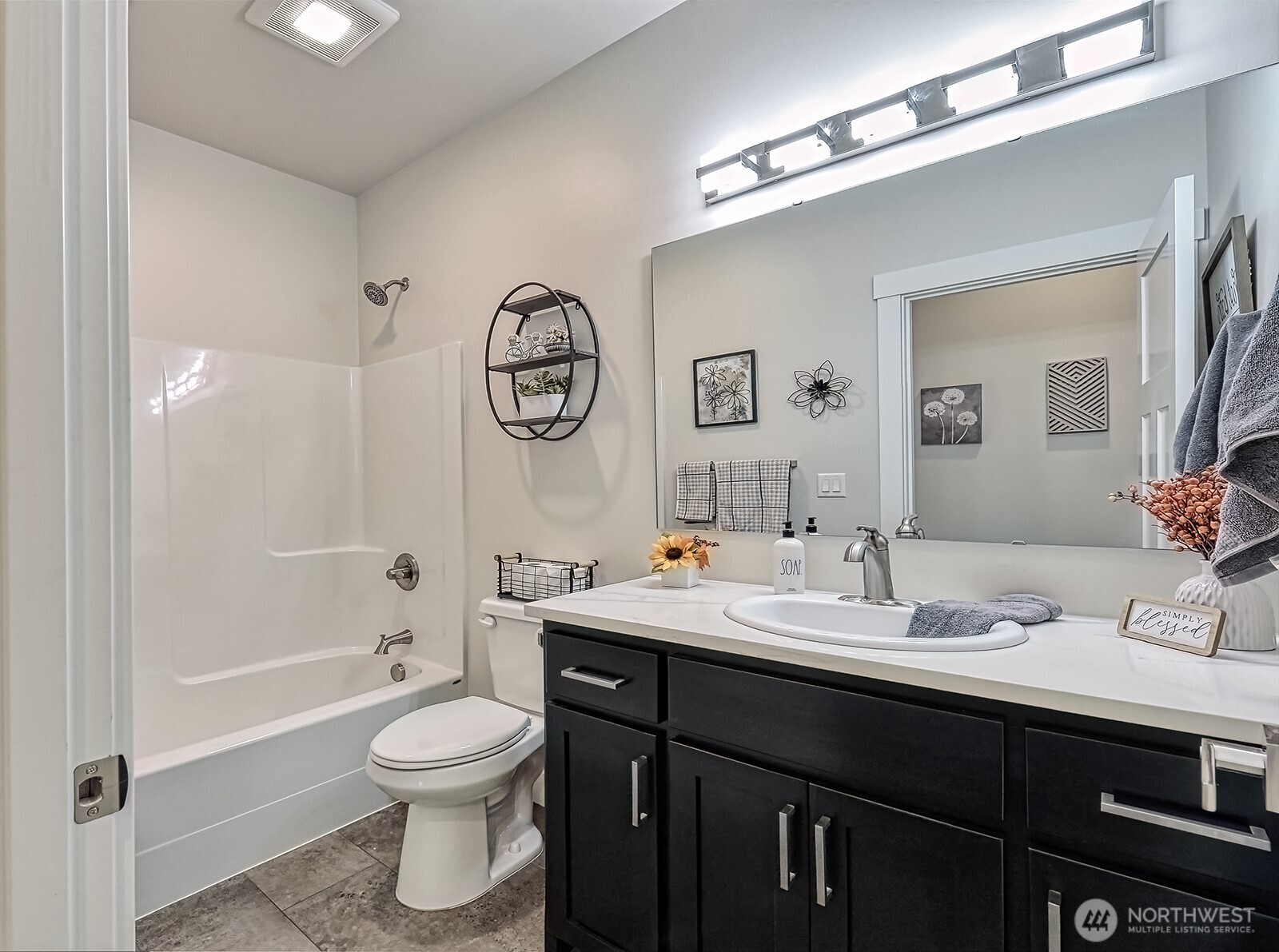 19443 Oakleaf Lane Sedro-Woolley, WA 98284 - Photo 15 of 39 a bathroom with a toilet a sink and a large mirror