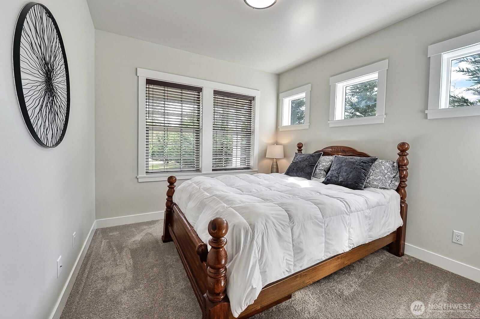 19443 Oakleaf Lane Sedro-Woolley, WA 98284 - Photo 19 of 40 a spacious bedroom with a bed and a window