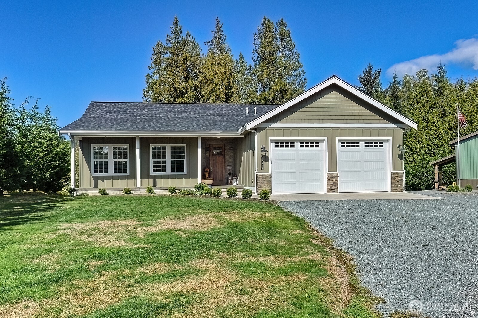 19443 Oakleaf Lane Sedro-Woolley, WA 98284 - Photo 2 of 40 a front view of a house with a yard