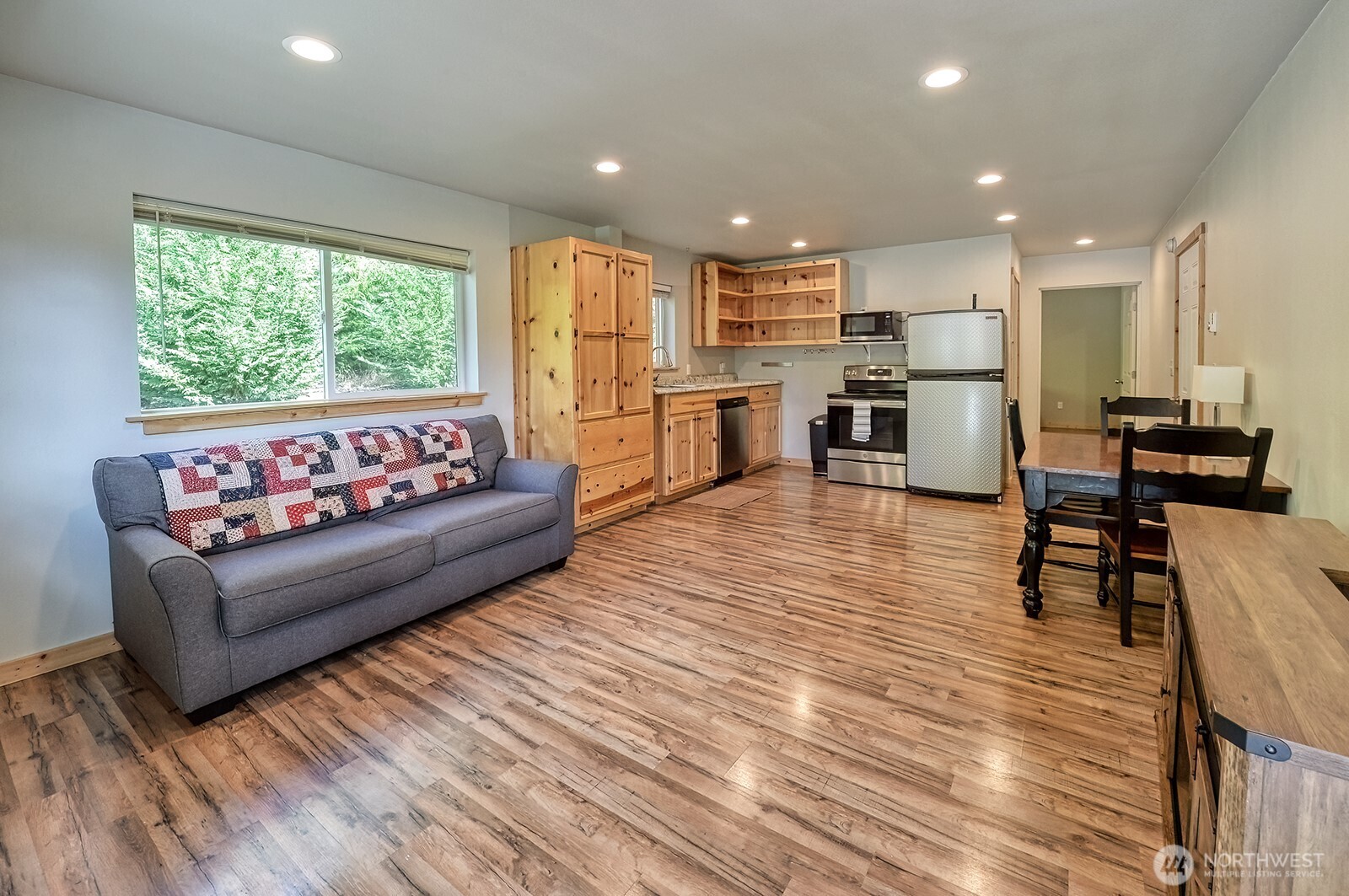 19443 Oakleaf Lane Sedro-Woolley, WA 98284 - Photo 29 of 39 a living room with furniture and kitchen view with wooden floor