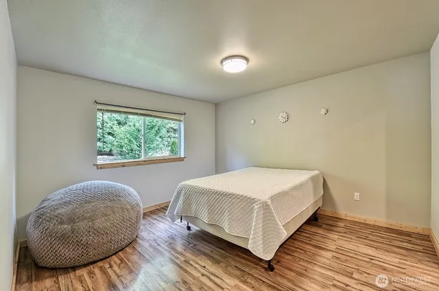 a kitchen with granite countertop stainless steel appliances a refrigerator stove top oven and sink