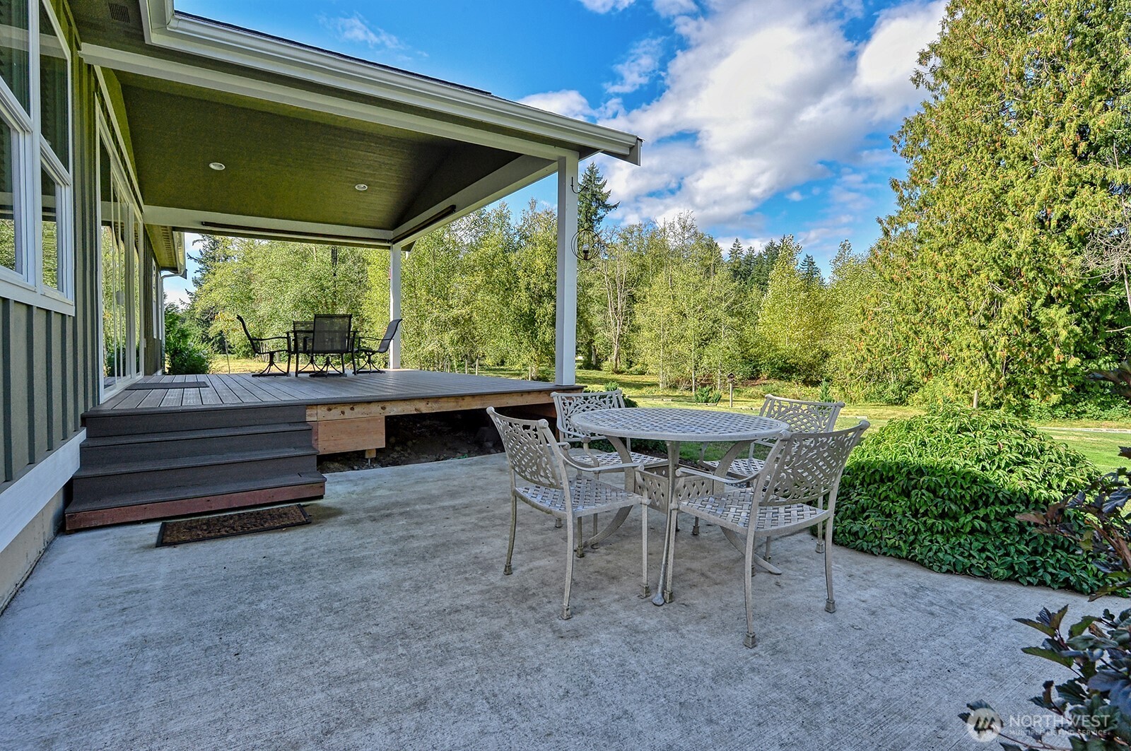19443 Oakleaf Lane Sedro-Woolley, WA 98284 - Photo 37 of 39 a view of a patio with table and chairs and potted plants
