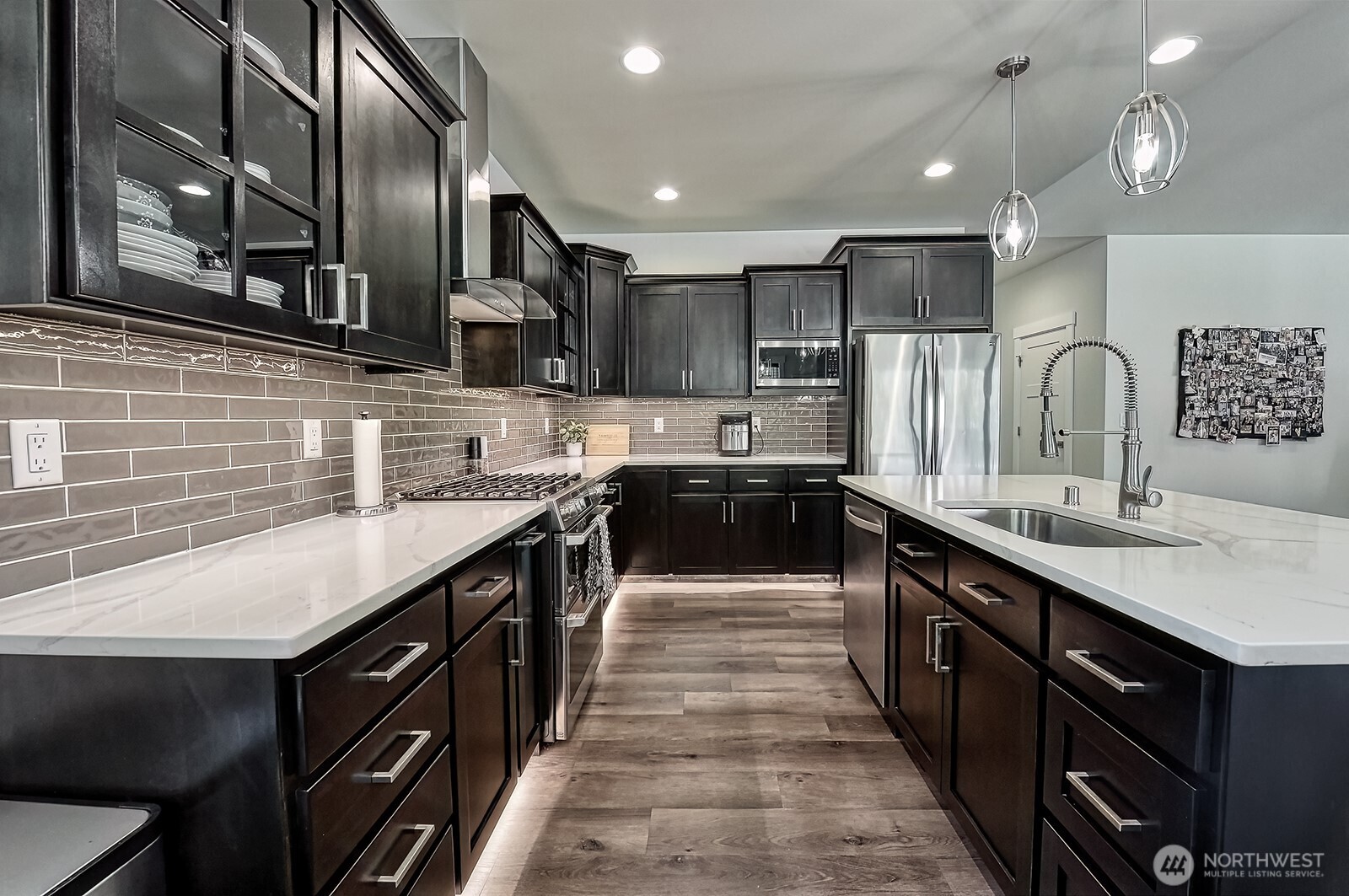 19443 Oakleaf Lane Sedro-Woolley, WA 98284 - Photo 8 of 40 a kitchen with stainless steel appliances kitchen island granite countertop a sink and a refrigerator