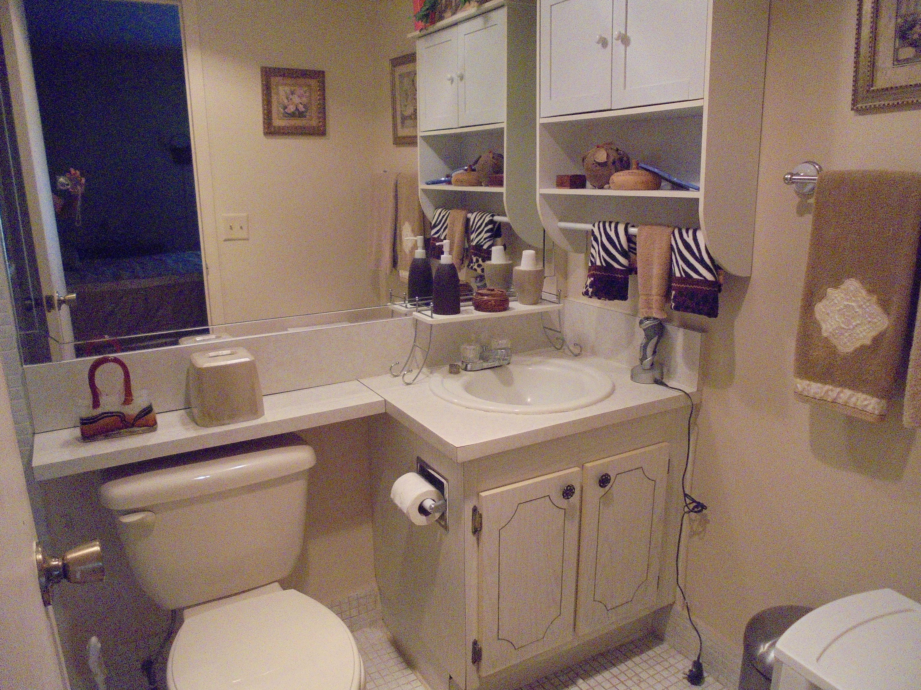 432 Mansfield K Boca Raton, FL 33434 - Photo 14 of 15 a bathroom with a sink a toilet and shower curtain