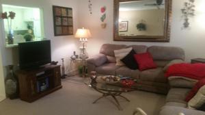 432 Mansfield K Boca Raton, FL 33434 - Photo 9 of 15 a living room with furniture and a flat screen tv