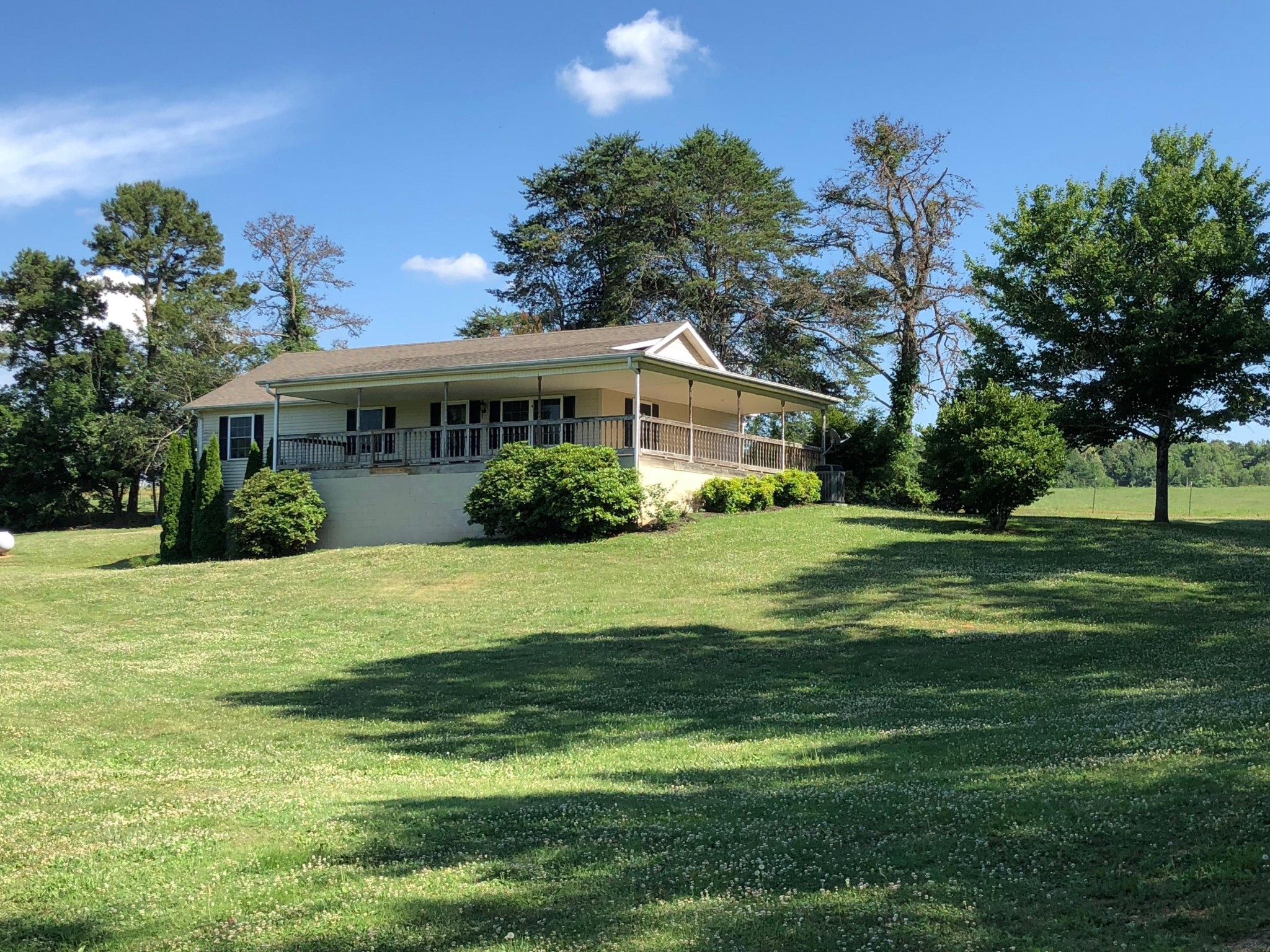 571 Raby Town Road Philadelphia, TN 37846 - Photo 3 of 29 a view of a house with a big yard and potted plants