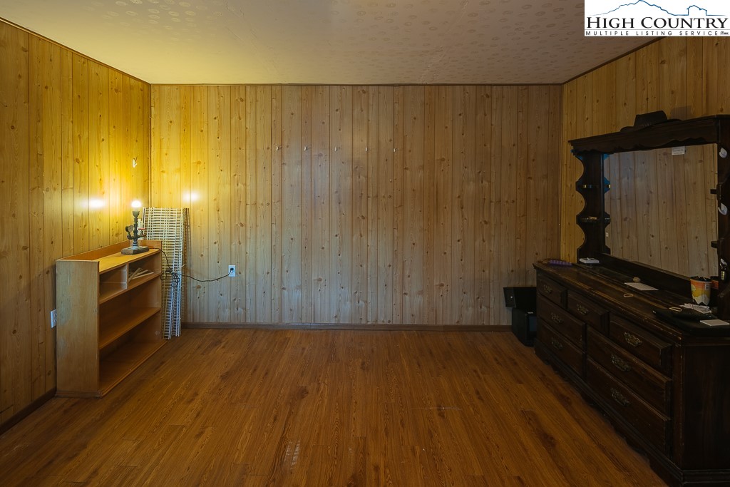 578 Charlie Hicks Road Banner Elk, NC 28604 - Photo 15 of 19 a view of a refrigerator in kitchen and wooden floor