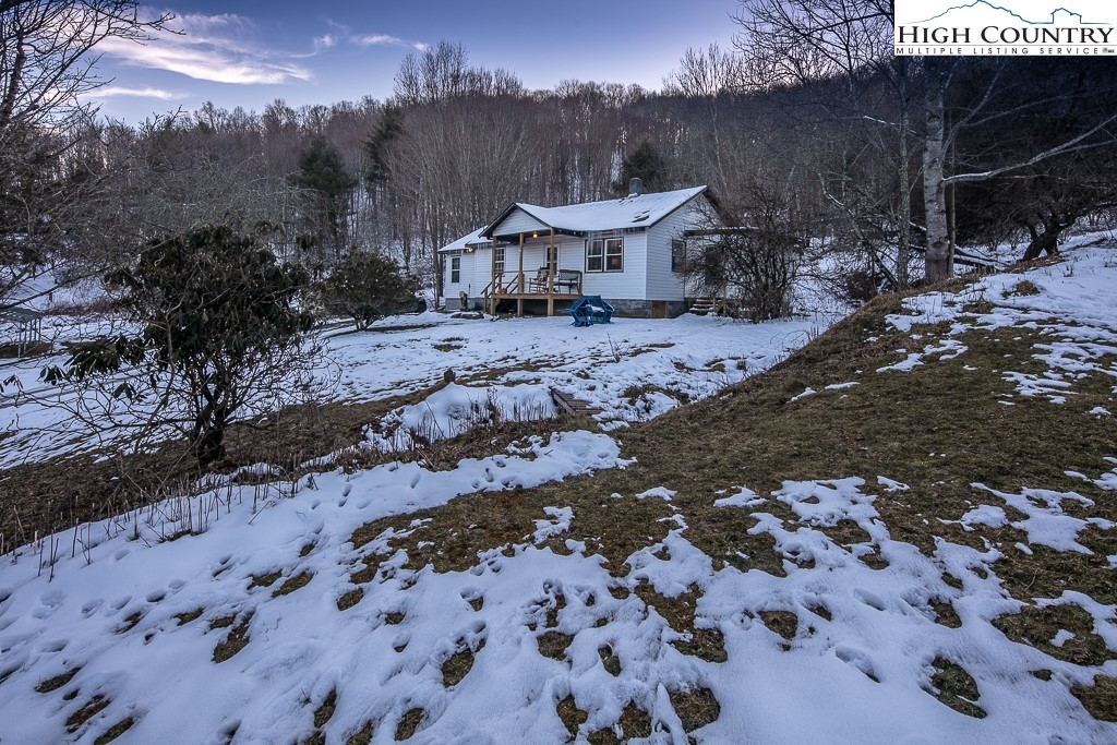 578 Charlie Hicks Road Banner Elk, NC 28604 - Photo 3 of 19 a view of a house with a yard