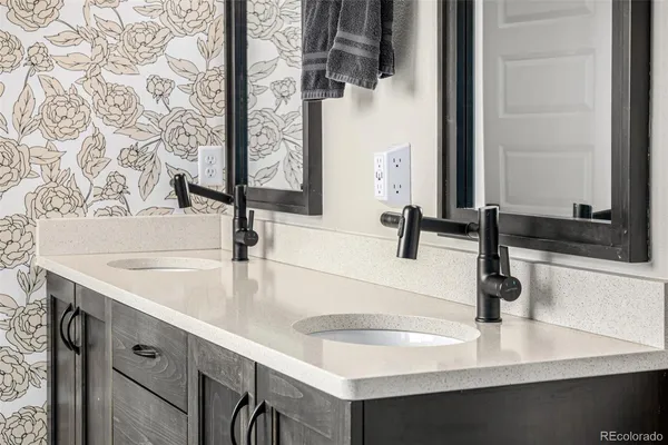 a kitchen with a sink and a refrigerator