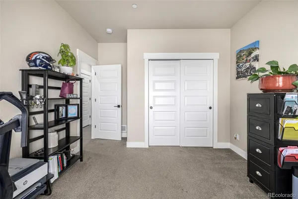 a view of an empty room with workspace and entryway