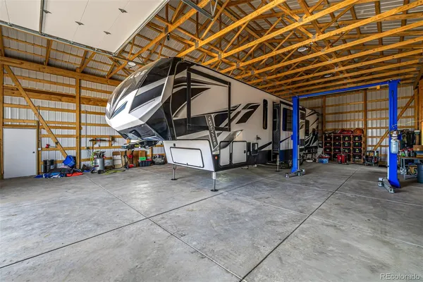 a view of a garage with parked cars