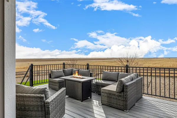 a view of a roof deck with couches