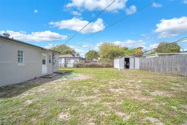 a view of a backyard with a garden and plants