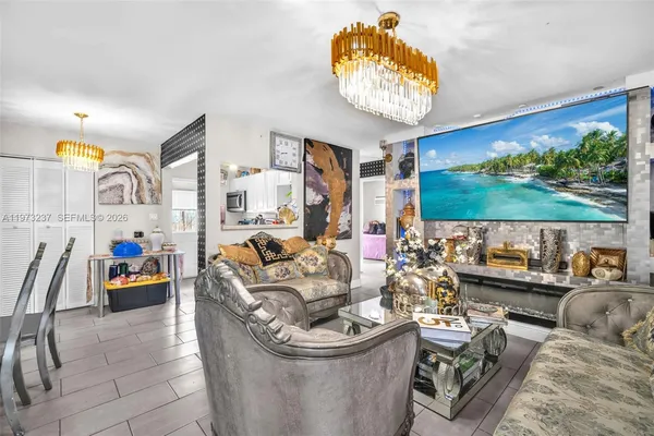 a living room with fireplace furniture and a flat screen tv