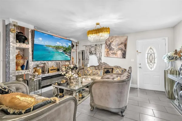 a living room with couches and a flat screen tv