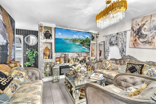 a living room with furniture and a flat screen tv