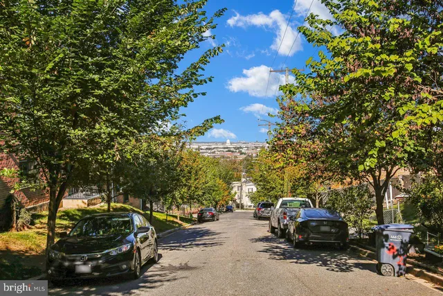 a view of car parked on the side of a road