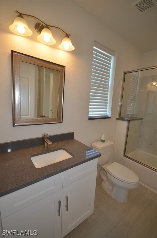8581 Agate Street Port Charlotte, FL 33981 - Photo 25 of 50 a bathroom with a granite countertop sink toilet and mirror