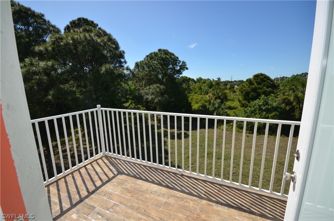 8581 Agate Street Port Charlotte, FL 33981 - Photo 31 of 50 a view of balcony with wooden floor