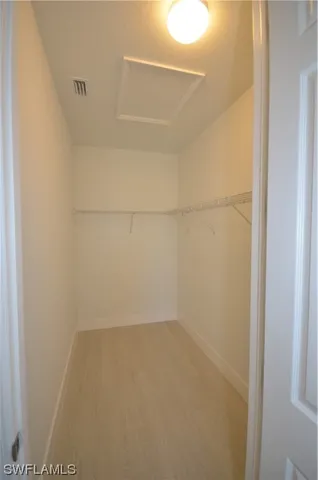 a view of an empty room with a fan