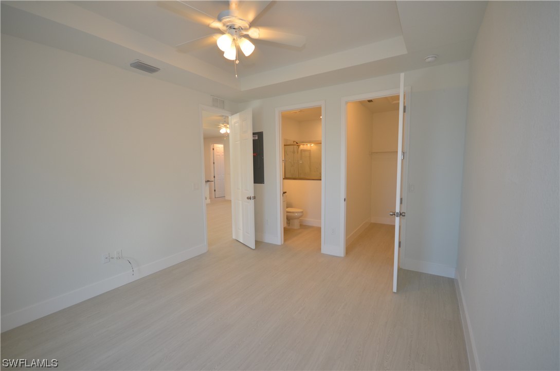 8581 Agate Street Port Charlotte, FL 33981 - Photo 37 of 50 a view of an empty room with a fan