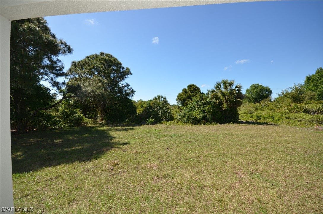 8581 Agate Street Port Charlotte, FL 33981 - Photo 44 of 50 a view of a field with an trees